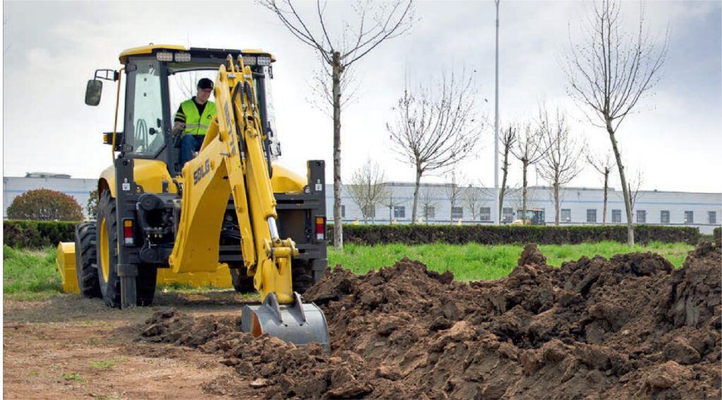 SDLG backhoe loader digging soil