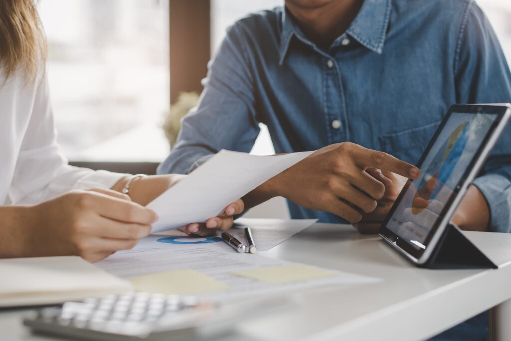 a finance professional showing budget allocation to a client